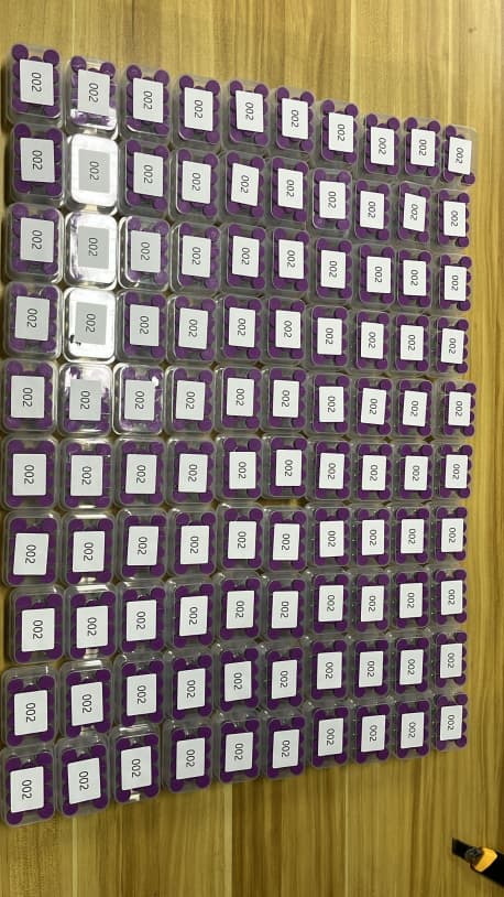 Order handling bench with packaged research vials prepared for shipment